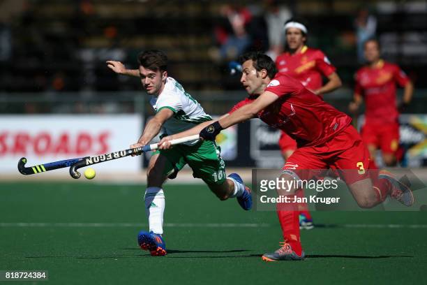 John McKee of Ireland and Sergi Enrique of Spain battle for possession during the Quarter final match between Spain and Ireland during Day 6 of the...