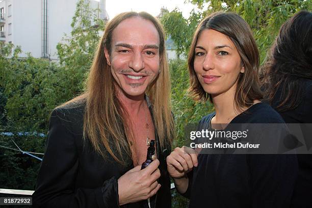 Sofia Coppola poses with John Galliano during the launch party for his new signature fragrance for women at John Galliano's Studio on July 8, 2008 in...