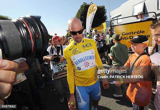 Yellow jersey German Stefan Schumacher leaves the anti-doping control bus after urine tests, on July 9 during the 232 km fifth and longest stage of...