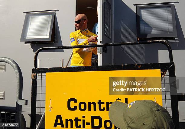 Yellow jersey German Stefan Schumacher leaves the anti-doping control bus after urine tests, on July 9 during the 232 km fifth and longest stage of...