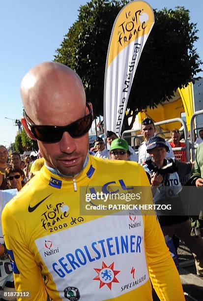 Yellow jersey German Stefan Schumacher leaves the anti-doping control bus after urine tests, on July 9 during the 232 km fifth and longest stage of...