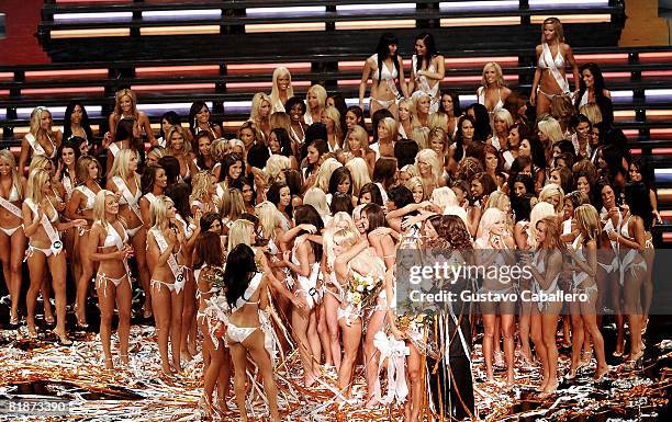 Sara Hoots celebrates on stage with the other contestants after winning the 12th Annual Hooters International Swimsuit Pageant at the Broward Center...