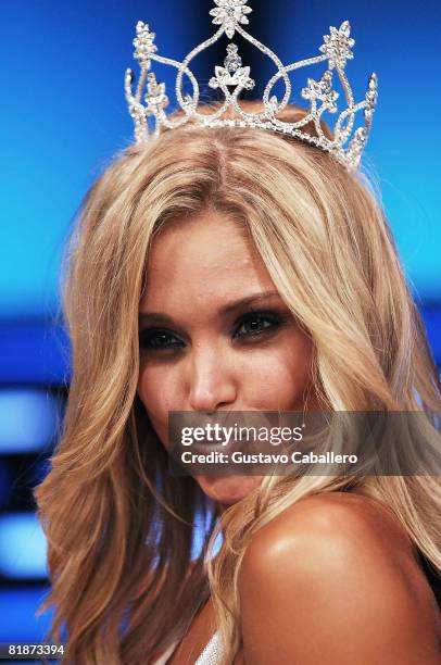 Sara Hoots poses on stage after winning the 12th Annual Hooters International Swimsuit Pageant at the Broward Center for the Performing Arts on July...