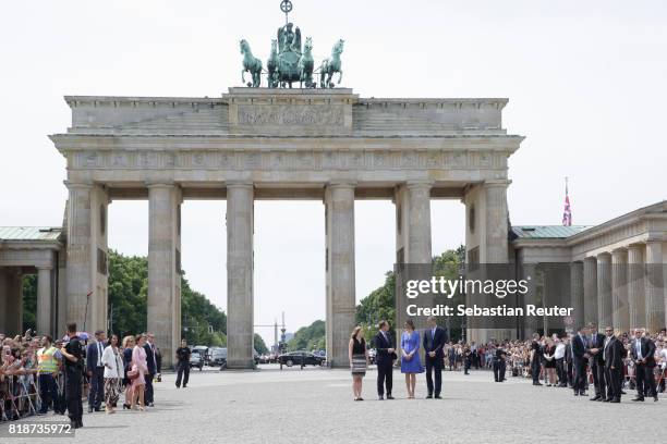 Prince William, Duke of Cambridge, Catherine, Duchess of Cambridge, Berlin Mayor Michael Mueller and his daughter arrive at the Brandenburg Gate...