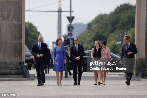 Prince William, Duke of Cambridge, Catherine, Duchess of Cambridge, Berlin Mayor Michael Mueller and his daughter arrive at the Brandenburg Gate...