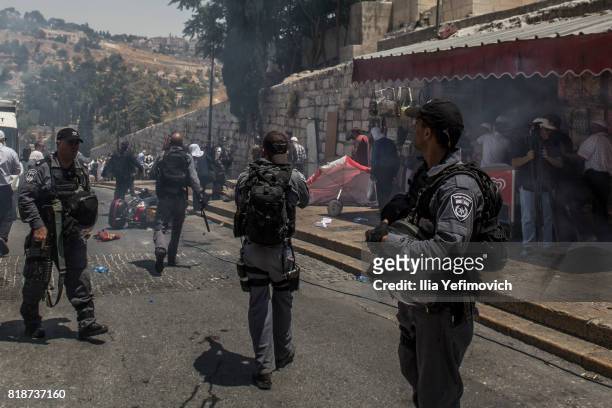 Palestinian Muslims clash outside the entrance to the old city of Jerusalem as it is partially blocked by Israeli Police on July 19, 2017 in...