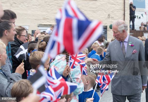 Prince Charles, Prince of Wales meets members of the public as he visits Porthleven during an annual trip to Devon and Cornwall on July 19, 2017 in...