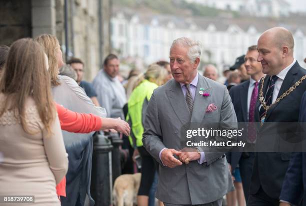 Prince Charles, Prince of Wales meets members of the public as he visits Porthleven during an annual trip to Devon and Cornwall on July 19, 2017 in...