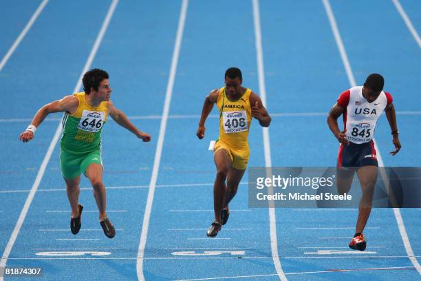 Wilhelm Van Der Vyver of South Africa finishes in second place in the men's 100m final from fourth place Yohan Blake of Jamaica and bronze medallist...