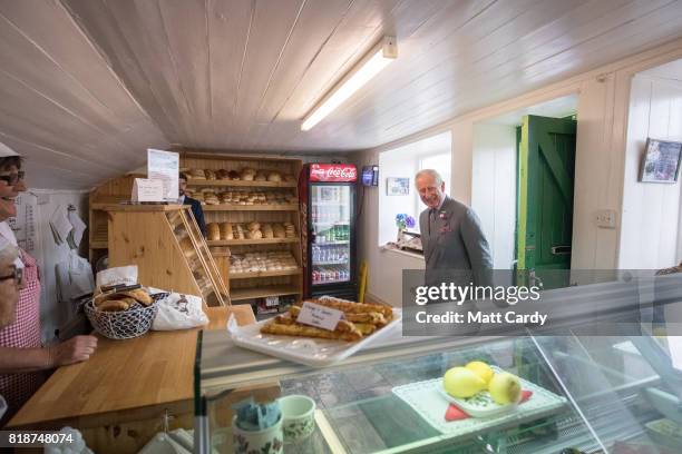 Prince Charles, Prince of Wales enters a bakery as he visits Porthleven during an annual trip to Devon and Cornwall on July 19, 2017 in Porthleven,...