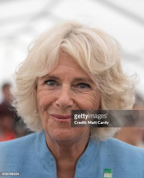 Camilla, Duchess of Cornwall, meets members of the public as she visits Porthleven during an annual trip to Devon and Cornwall on July 19, 2017 in...