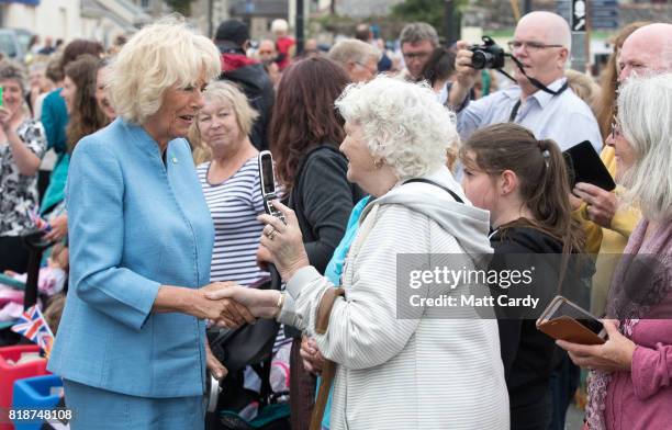 Camilla, Duchess of Cornwall, meets members of the public as she visits Porthleven during an annual trip to Devon and Cornwall on July 19, 2017 in...