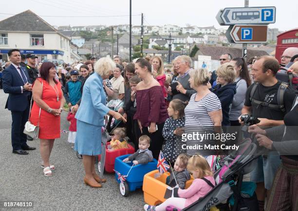Camilla, Duchess of Cornwall meets members of the public as she visits Porthleven during an annual trip to Devon and Cornwall on July 19, 2017 in...