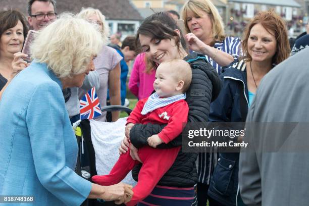 Camilla, Duchess of Cornwall meets members of the public as she visits Porthleven during an annual trip to Devon and Cornwall on July 19, 2017 in...