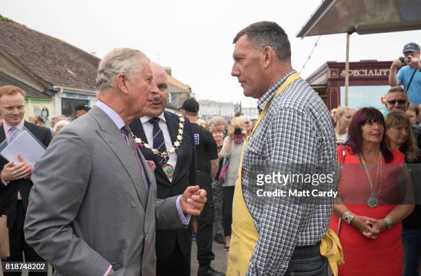 Prince Charles, Prince of Wales meets Dale Reardon from Helston a retained firefighter who was in Coverack last night and runs Hand Cut Cornish Fudge...
