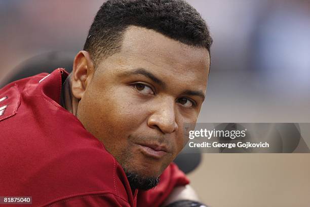 Outfielder Carlos Lee of the Houston Astros looks on from the dugout during a game against the Pittsburgh Pirates at PNC Park on July 7, 2008 in...