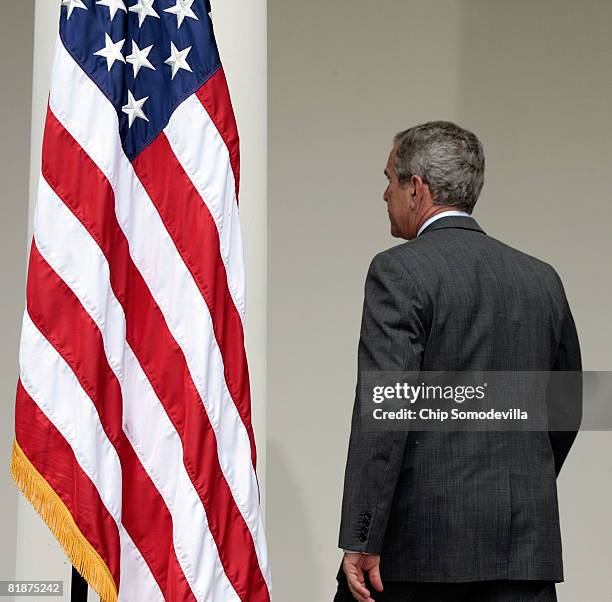 President George W. Bush walks back to the Oval Office after making a statement about Congress passing the controversial Foreign Intelligence...