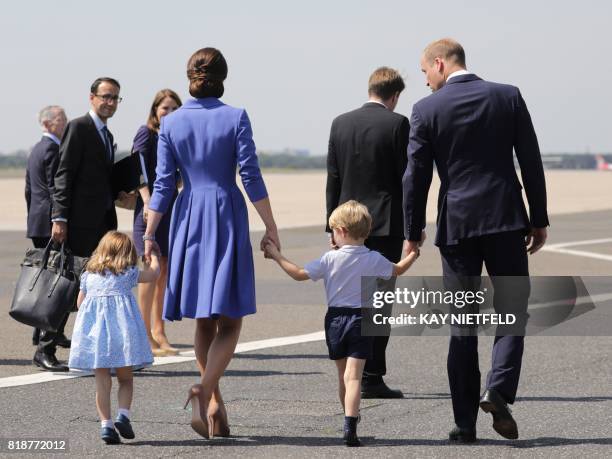 Britain's Prince William, Duke of Cambridge, his wife Kate, the Duchess of Cambridge with their children Prince George and Princess Charlotte arrive...