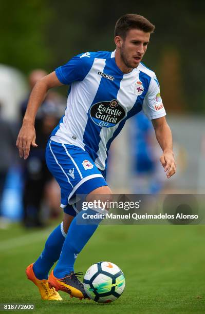 Gerard Valentin of Deportivo de La Coruna runs with the ball during the pre-season friendly match between Cerceda and Deportivo de La Coruna at O...