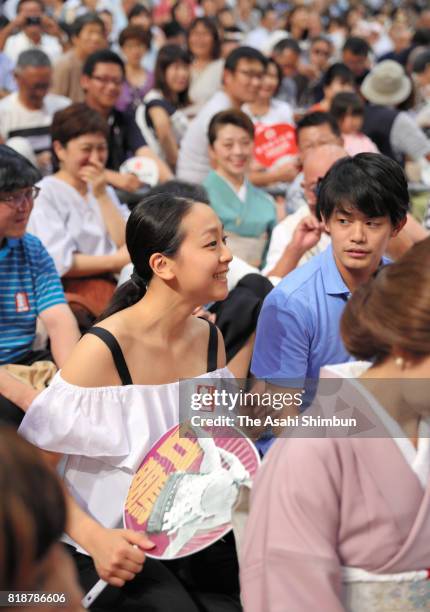 Former figure skaters Mao Asada and Takahiko Kozuka enjoy sumo bouts during day eleven of the Grand Sumo Nagoya Torunament at Aichi Prefecture...