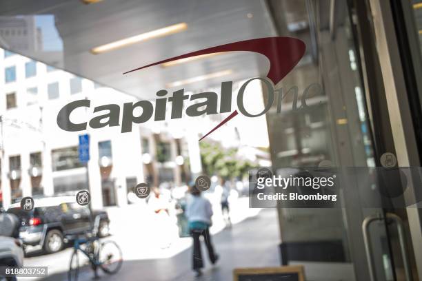 Signage is displayed on the door of a Capital One Financial Corp. Cafe branch in San Francisco, California, U.S., on Monday, July 17, 2017. Capital...