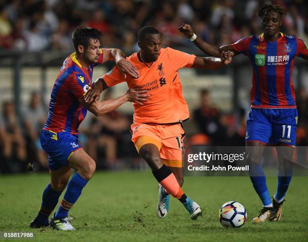 Daneil Sturridge of Liverpool competes with Scott Dann of Crystal Palace during the Premier League Asia Trophy match between Liverpool FC and Crystal...