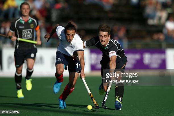 Moritz Trompertz of Germany and Charles Masson of France battle for possession during the Quarter final match between Germany and France during Day 6...