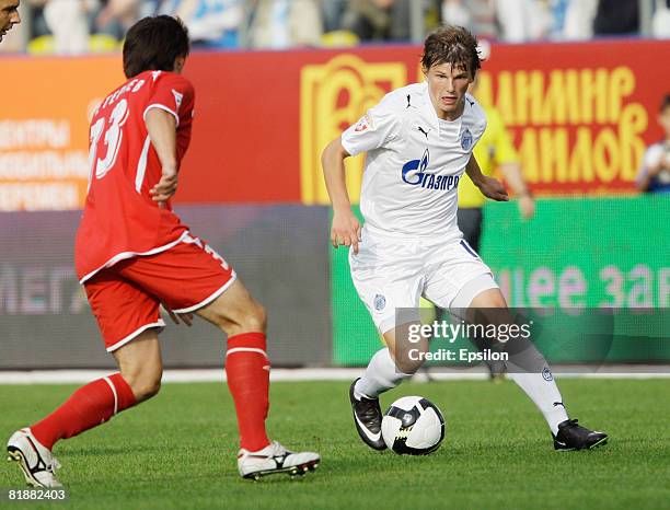 Andrey Arshavin of FC Zenit, St. Petersburg competes for the ball with Kazbek Geteriev of FC Spartak Nalchik during the Russian Football League...