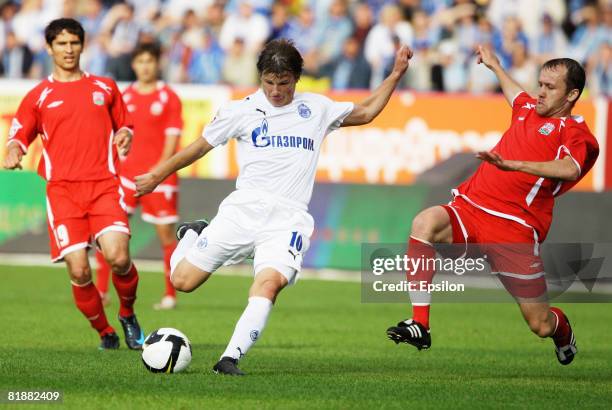 Andrey Arshavin of FC Zenit, St. Petersburg competes for the ball with Aslan Mashukov of FC Spartak Nalchik during the Russian Football League...