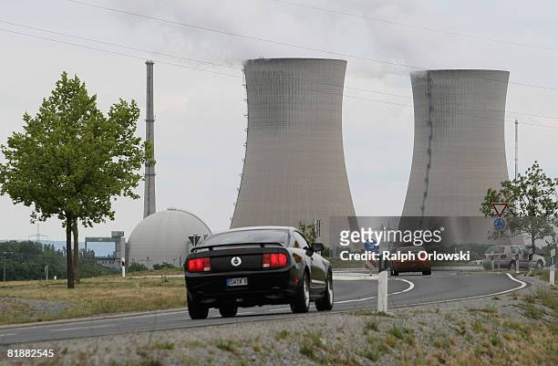 Cars drive past Grafenrheinfeld nuclear power plant on July 9, 2008 in Grafenrheinfeld near Wuerzburg, Germany. Many German politicians are urging a...