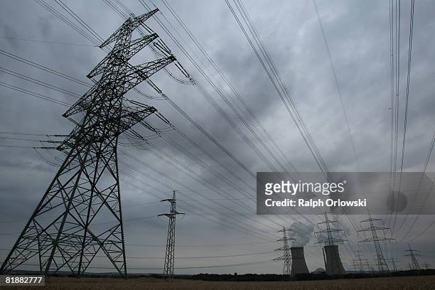 Electricity pylons stand in front of Grafenrheinfeld nuclear power plant on July 9, 2008 in Grafenrheinfeld near Wuerzburg, Germany. Many German...