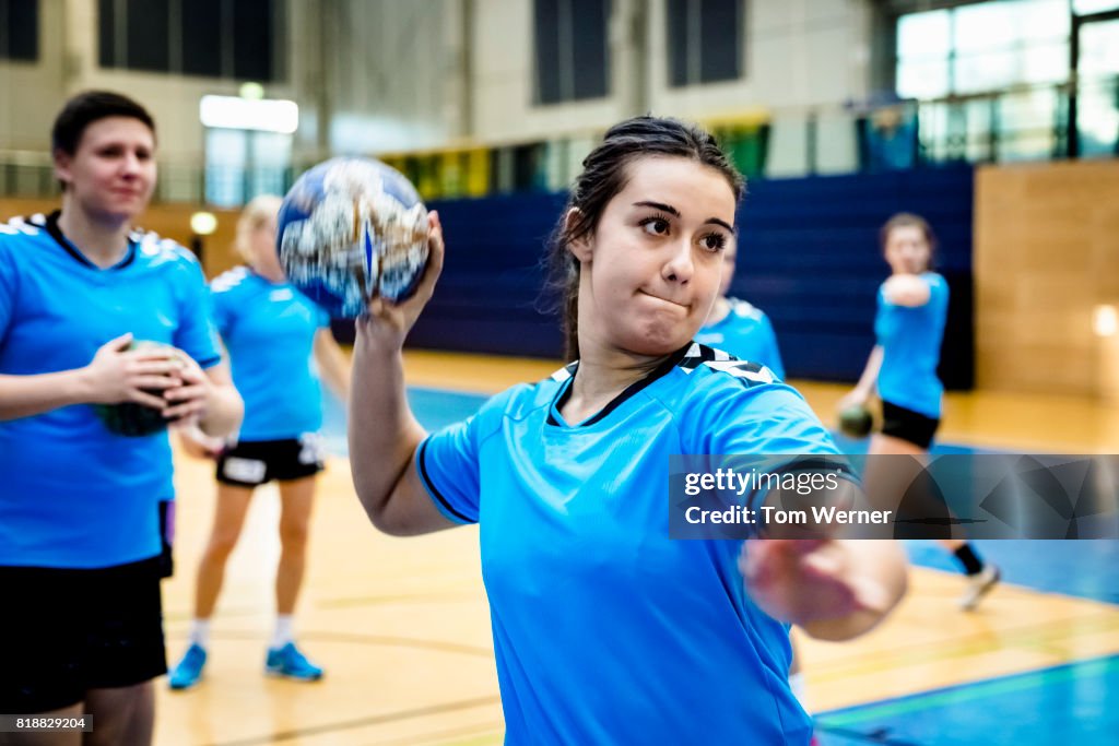 Female handball player throwing ball