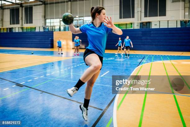 female handball player throwing ball - court handball bildbanksfoton och bilder