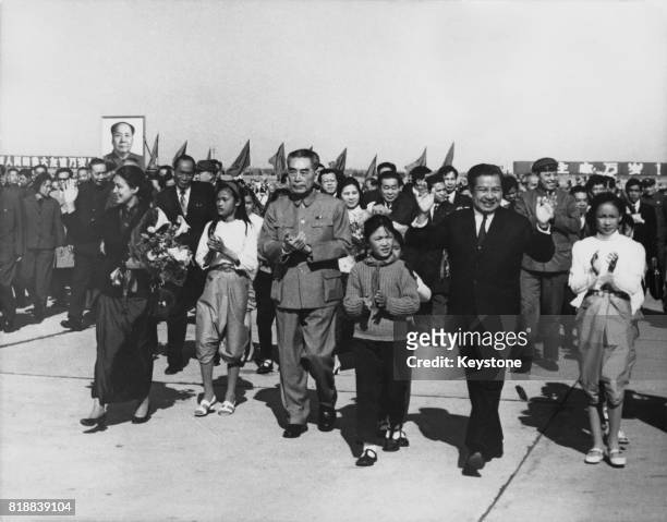 Zhou Enlai , Premier of the People's Republic of China, welcomes Prince Norodom Sihanouk of Cambodia to Peking Airport after his inspection tour of...