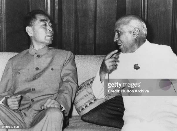 Zhou Enlai , Premier of the People's Republic of China, with Indian Prime Minister Jawaharlal Nehru during a visit to India, 21st April 1960.