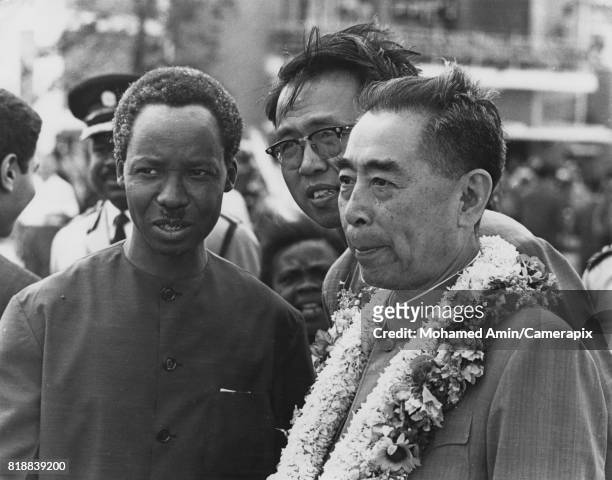 Zhou Enlai , Premier of the People's Republic of China, is greeted by President Julius Nyerere of Tanzania as he arrives at Dar es Salaam Airport for...