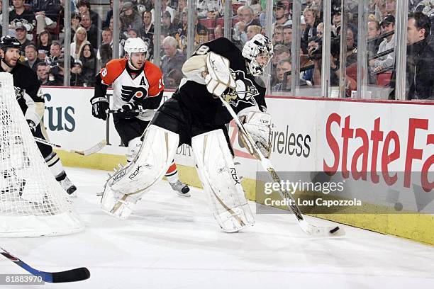 Hockey: NHL Playoffs, Pittsburgh Penguins goalie Marc-Andre Fleury in action, clearing puck from behind net vs Philadelphia Flyers Mike Richards ,...