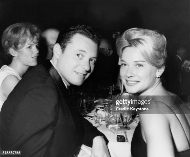 Actress Hope Lange and her partner, director and producer Alan J. Pakula, at the Writers Guild of America 15th Annual Screen Awards dinner at the...