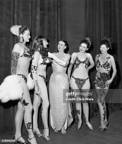 American entertainer Gypsy Rose Lee with Sherry Clark, Charlotte Foley, June Fraser and Anita Arden, who appear on her act, Bristol, UK, 1951.