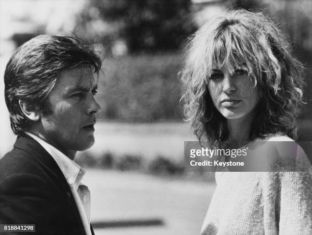 French actor Alain Delon and Italian actress Dalila Di Lazzaro on the set of the film 'Trois hommes à abattre', , France, 8th October 1980.