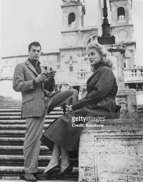 Married American actors Tony Curtis and Janet Leigh on the steps of Trinita dei Monti in Rome, where they are on vacation, 9th December 1955.
