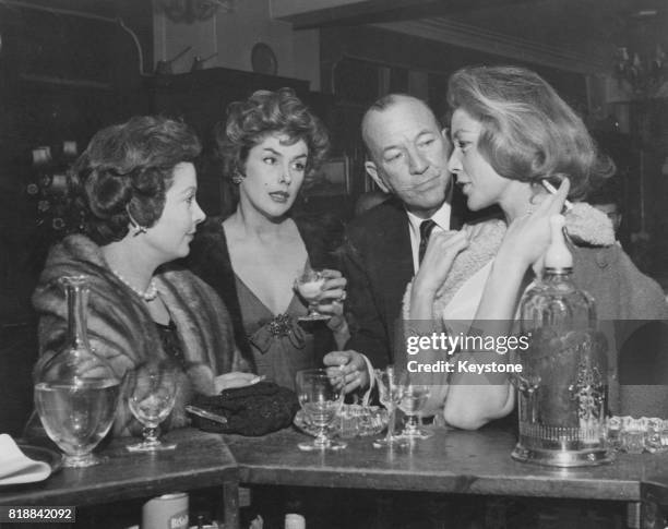 From left to right, British actress Vivien Leigh , actress Kay Kendall, actor Noel Coward and actress Lauren Bacall at St Martin's Theatre in London,...