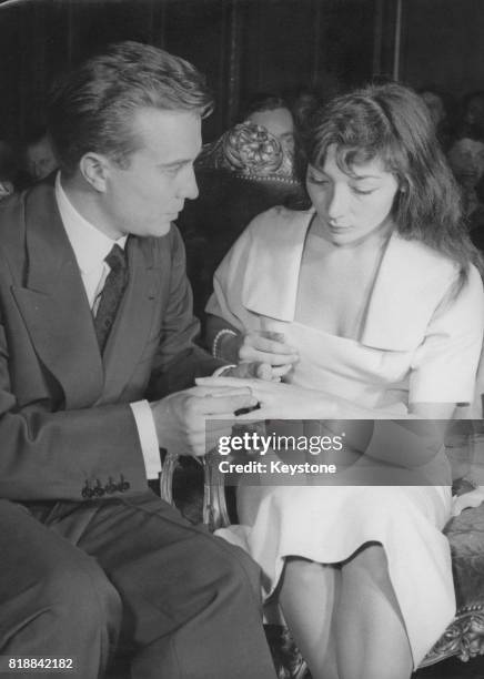 French actor Philippe Lemaire marries singer Juliette Gréco in a civil wedding at the town hall of the 8th arrondissement in Paris, 25th June 1953.