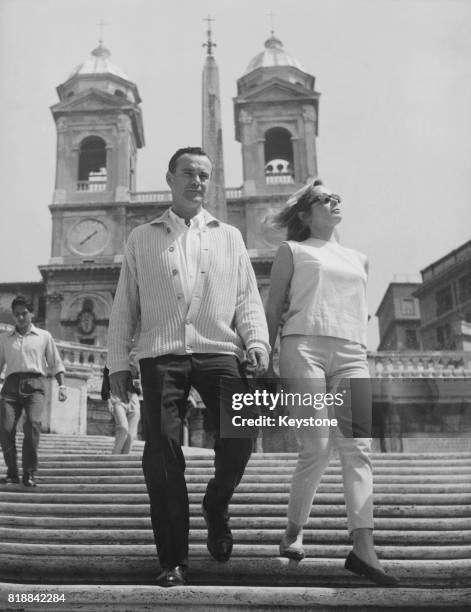 American actor Jack Lemmon with his new wife, actress Felicia Farr, on the Spanish Steps during a holiday in Rome, Italy, 1st September 1962.