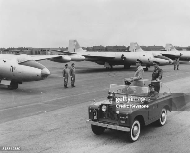General Lyman Lemnitzer of the United States Army, Supreme Allied Commander Europe of NATO, inspects plans at RAF Scampton in the UK with Air Marshal...