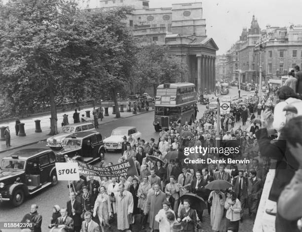 British actress Vivien Leigh and her husband, actor Laurence Olivier lead a protest march against the proposed closing of the St James' Theatre, in...