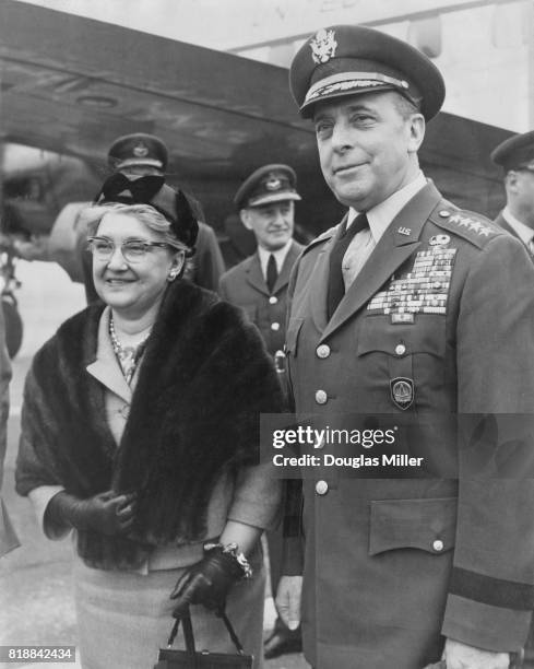 General Lyman Lemnitzer of the United States Army, Supreme Allied Commander Europe of NATO, arrives at Northolt with his wife, UK, 9th April 1963.