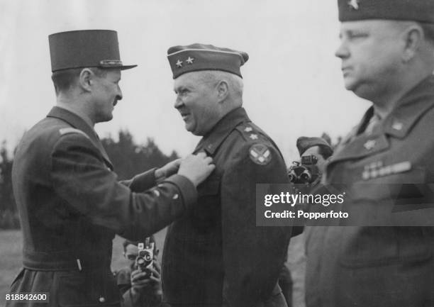 French general Philippe François Marie Leclerc de Hauteclocque presents Major General Wade H. Haislip of the US Army with the medals of the Chevalier...