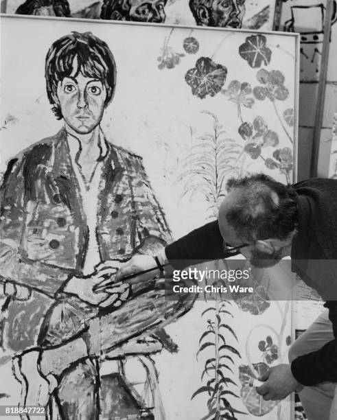 Artist John Bratby works on his portrait of Paul McCartney of the Beatles, which he will submit to the Royal Academy for their Summer Exhibition, UK,...