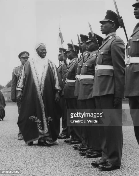 Ahmadu Bello , the premier of Northern Nigeria, inspects Nigerian cadets at the Mons Officer Cadet School in Aldershot, during a visit to the UK,...